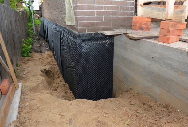 Happy homeowners after waterproofing job in Bon Air